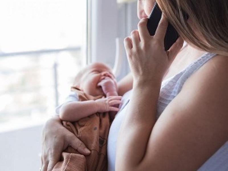 New Mom with Baby talking on call