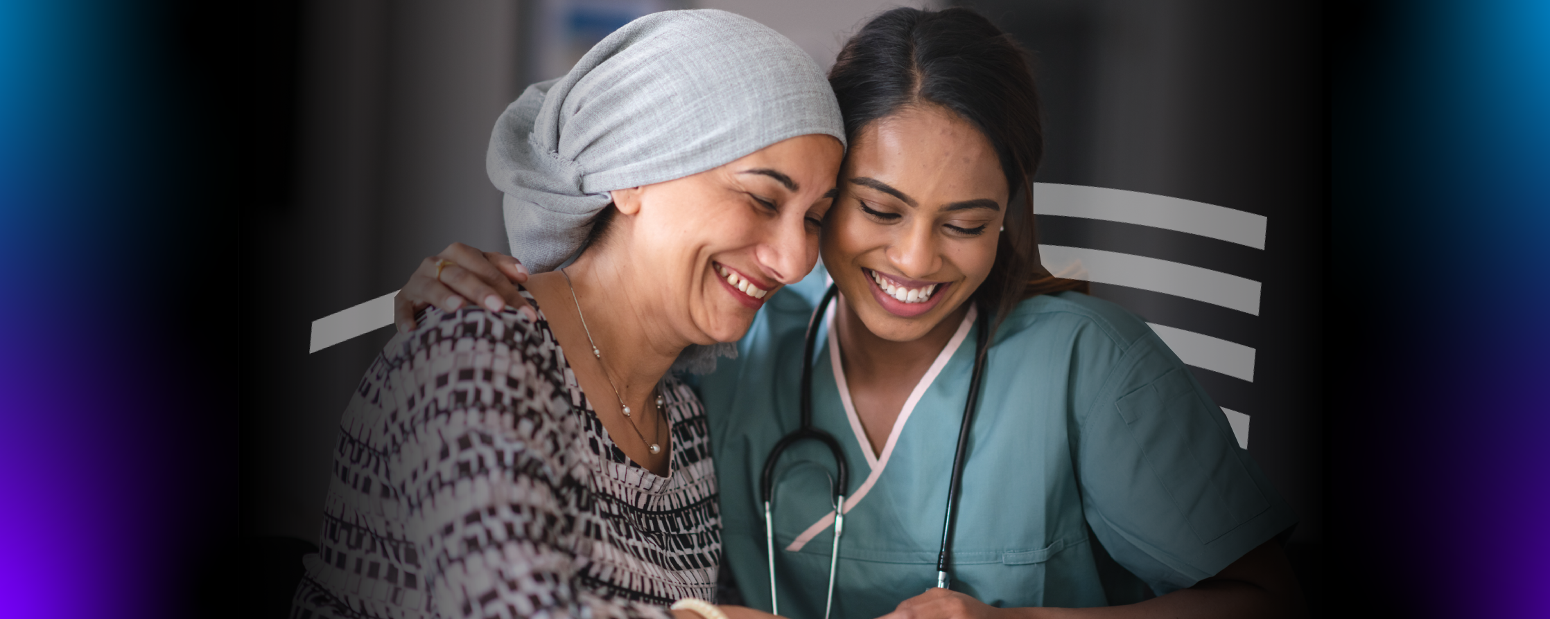 Cancer Patient and medical provider hugging and smiling