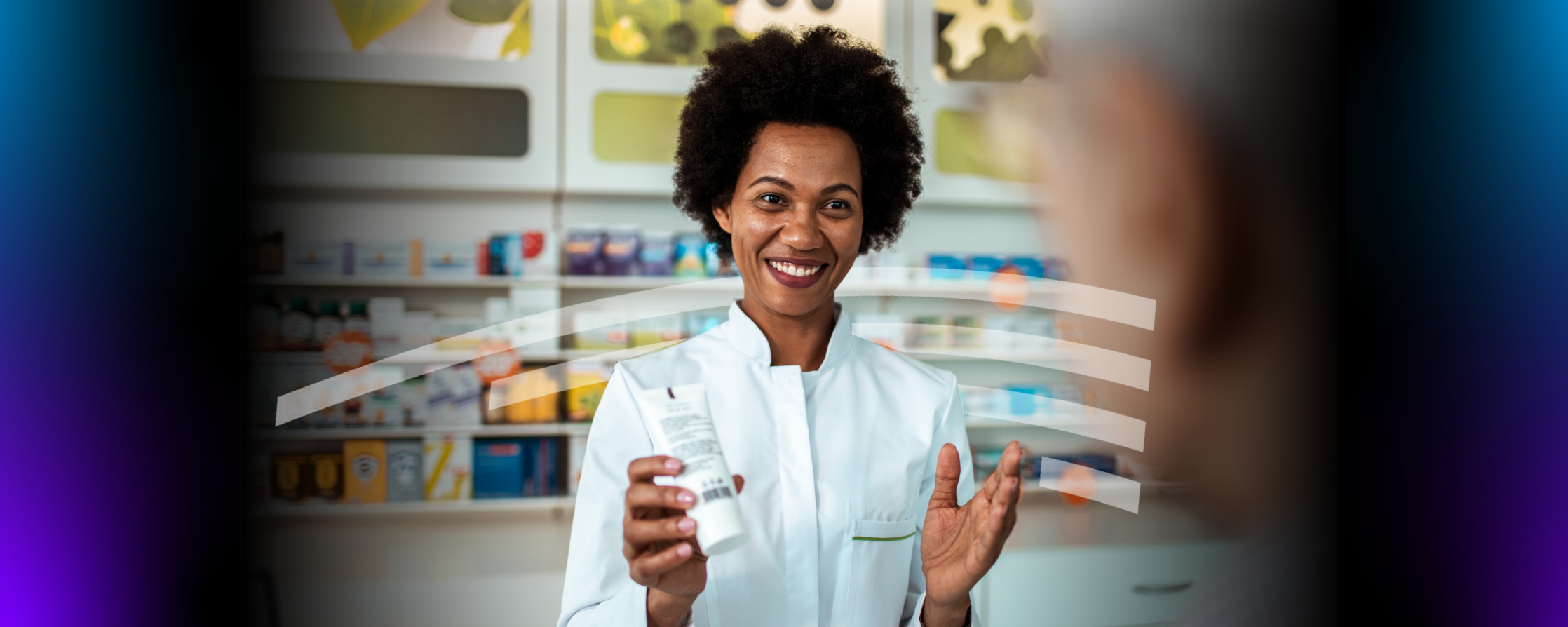 Pharmacist handing a cream to a patient