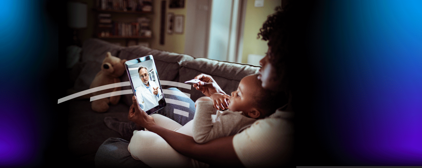 Woman with toddler attending virtual appointment