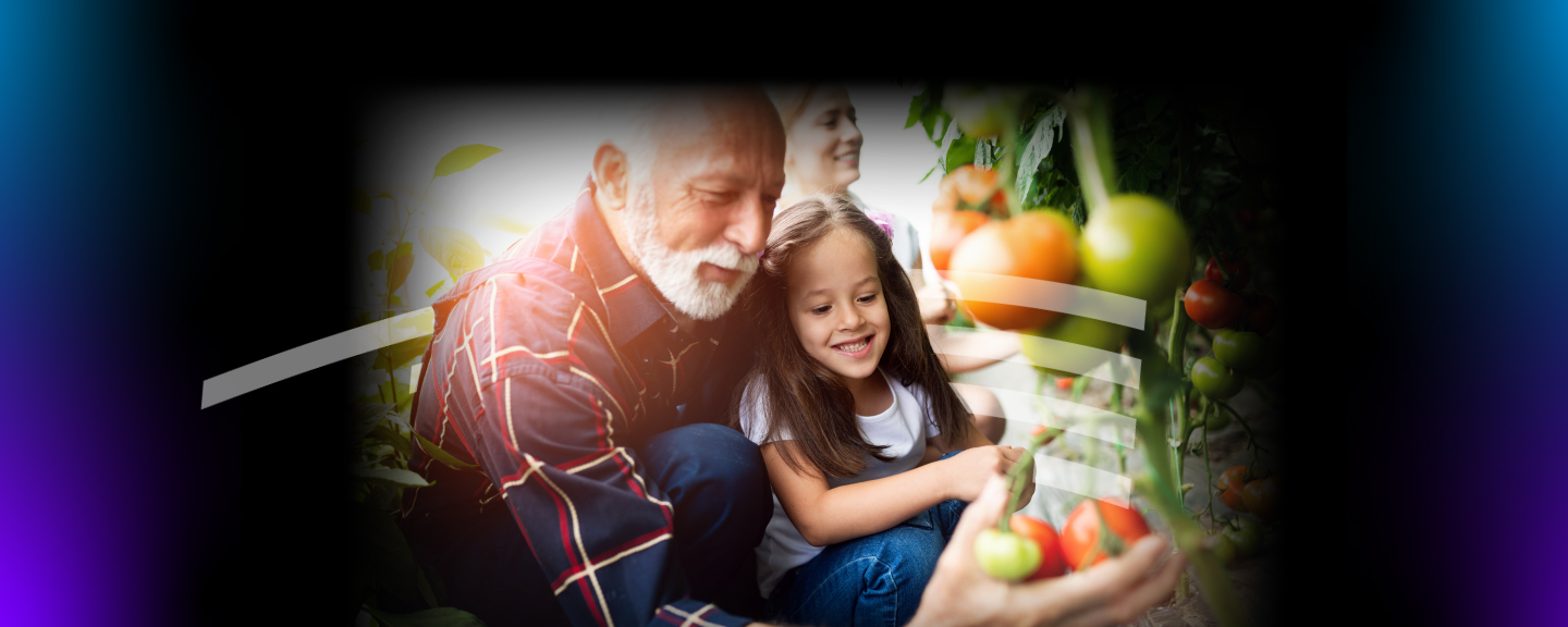 Man and granddaughter apple picking