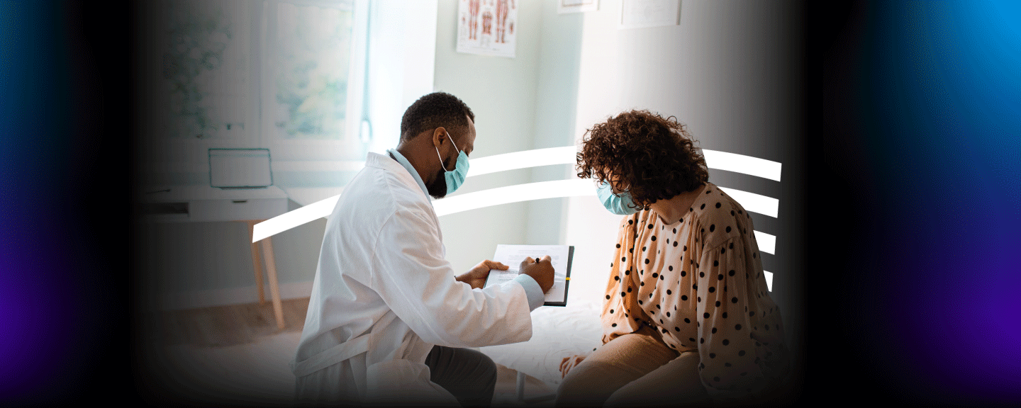 doctor reviewing paperwork with a patient in a medical office