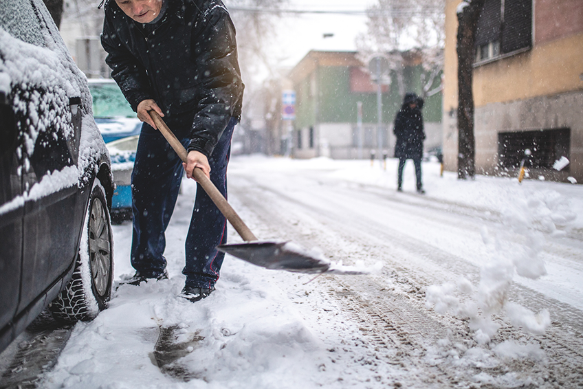 man shoveling snow