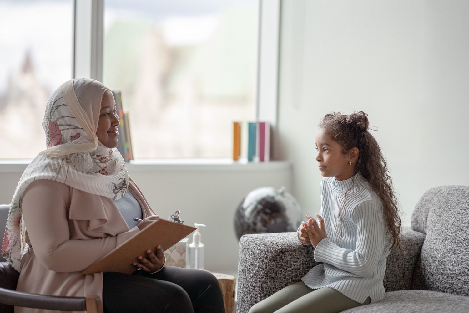 Healthcare worker interacting with child