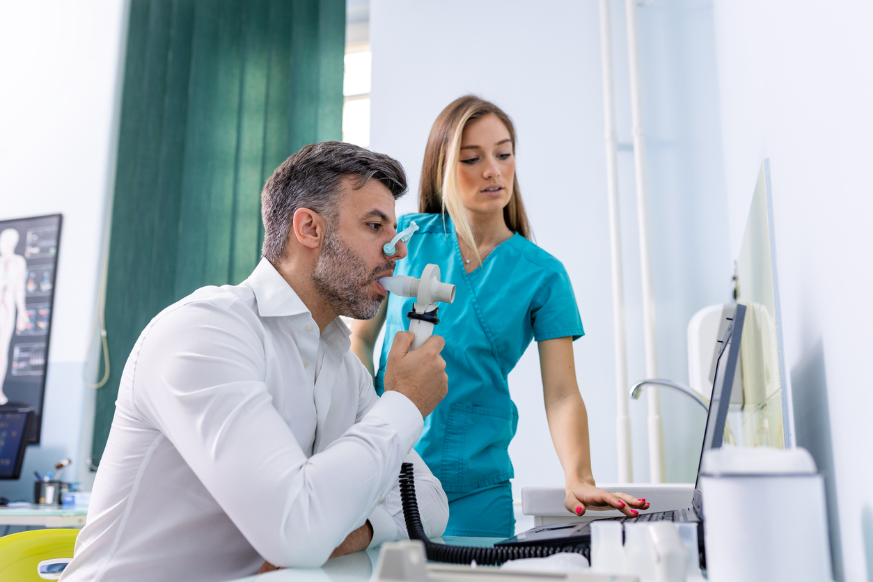 man taking spirometry test for COPD conditions in hospital