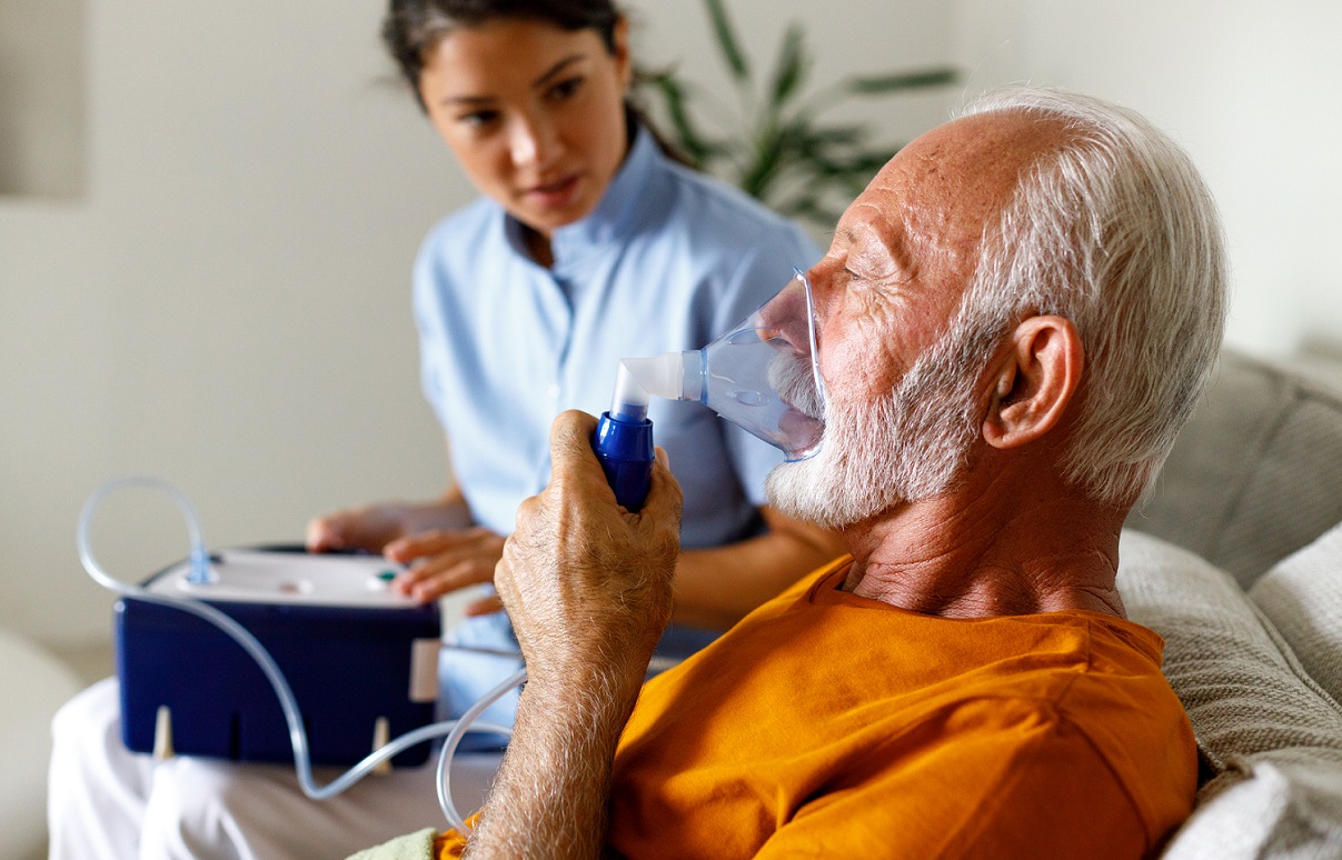 Old man taking oxygen therapy 