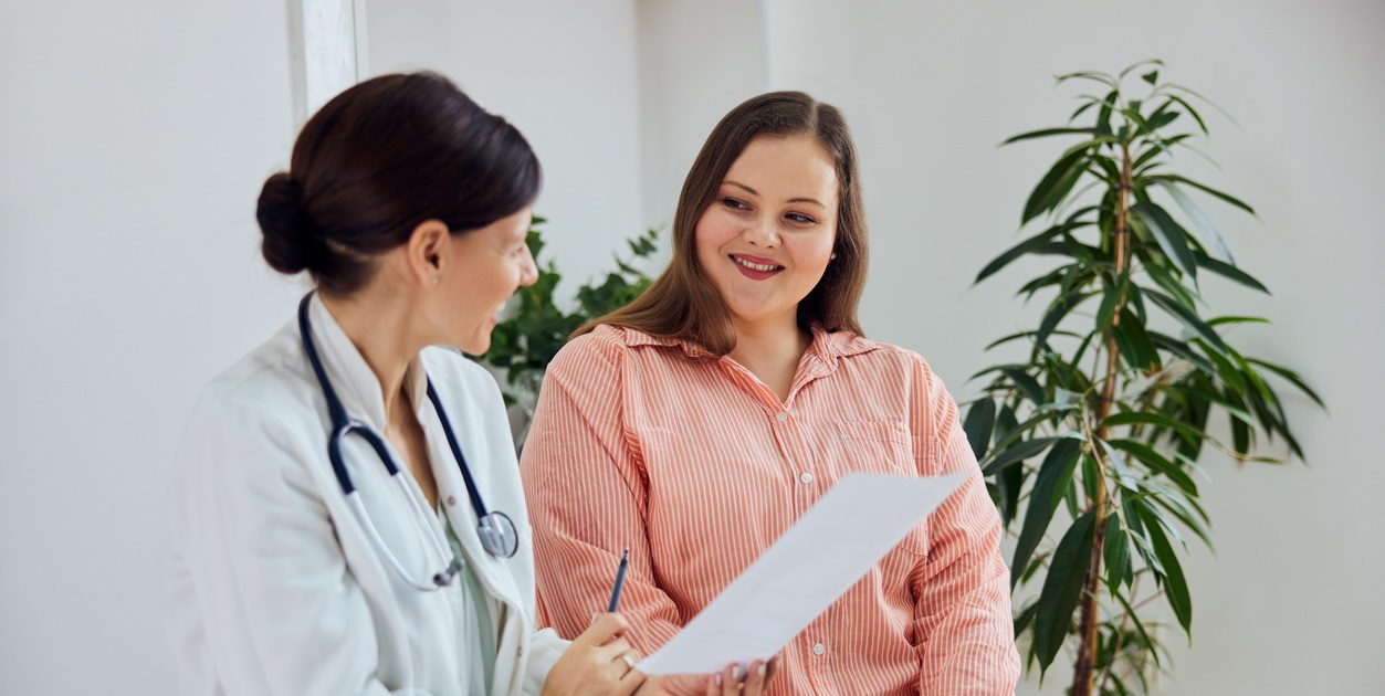 Young woman consulting with doctor