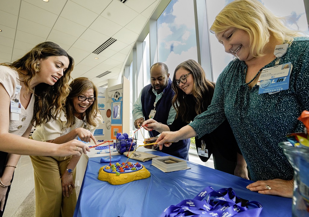 Inspira staff playing game