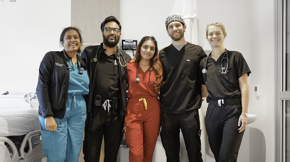 Nurses and support staff standing for pictures