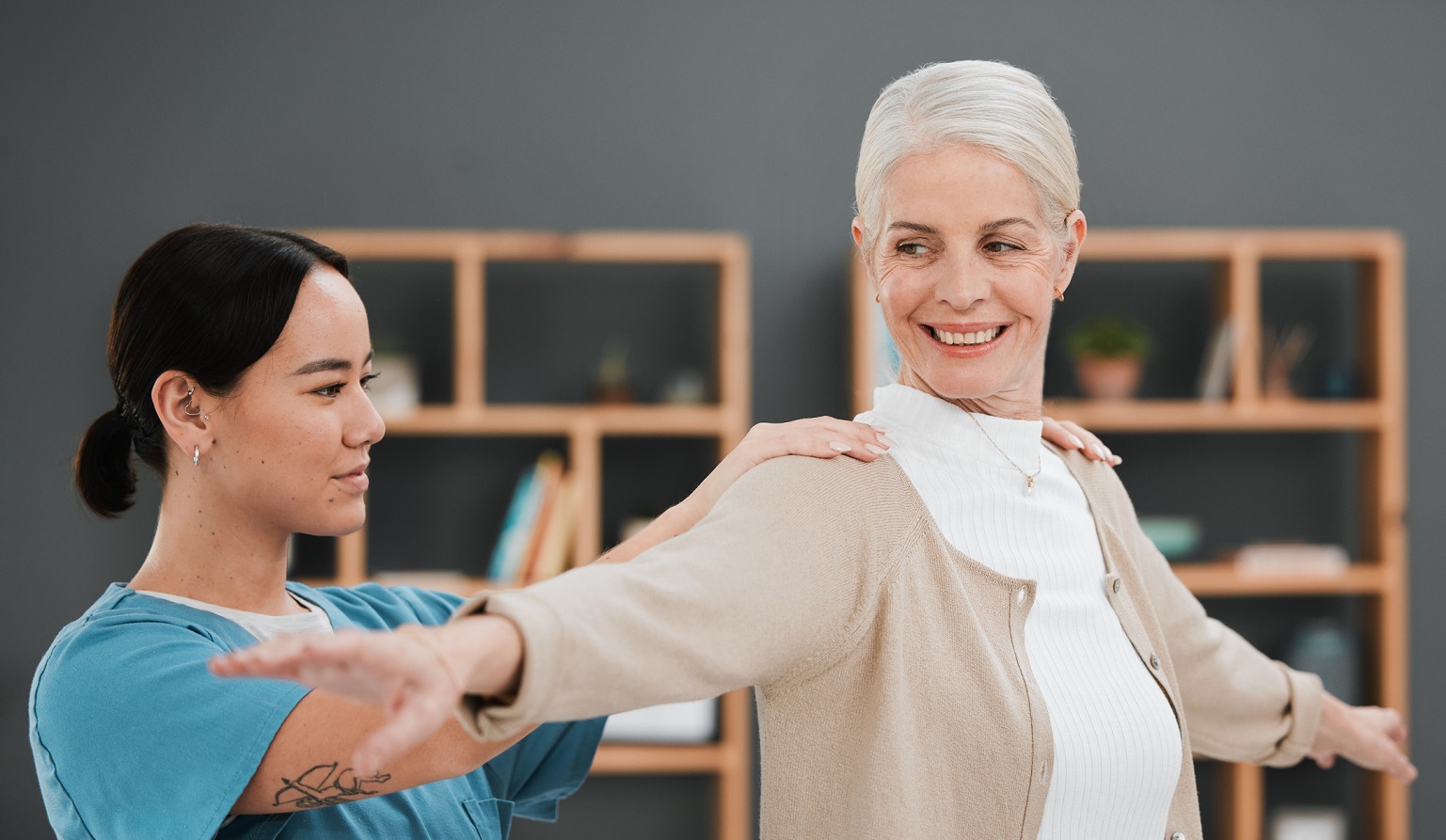 occupational therapist works with an elderly woman