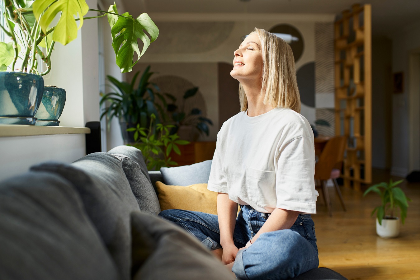 Young woman enjoying sun with closed eyes 