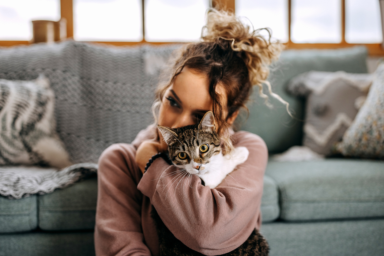 woman playing with her cat