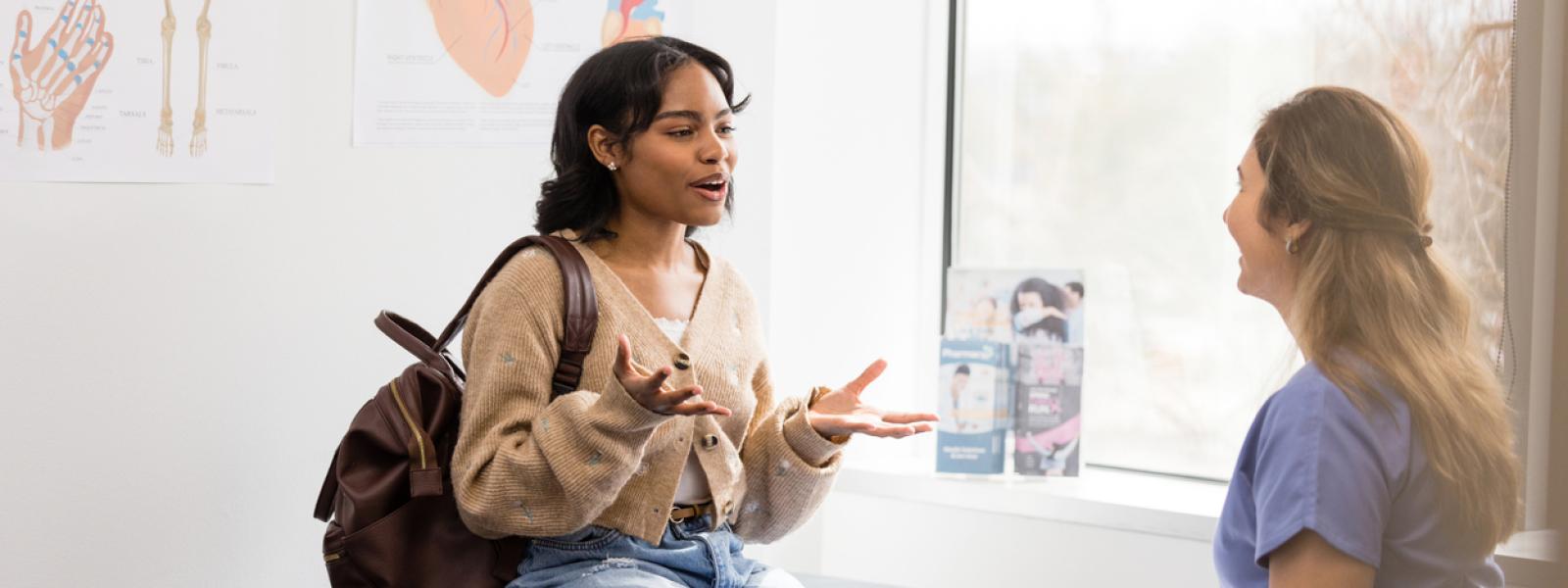 Teen girl consulting with doctor 