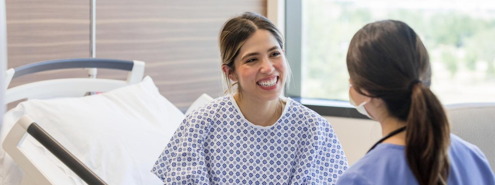 Female doctor talking to a young female patient 