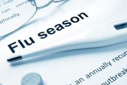 paper that reads "Flu Season" with thermometer on top