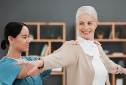 occupational therapist works with an elderly woman