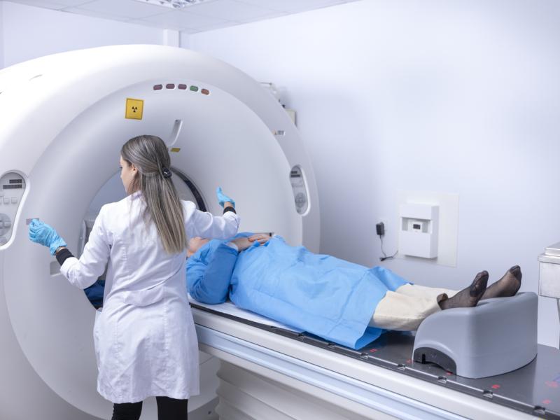 Doctor readying patient for radiation therapy