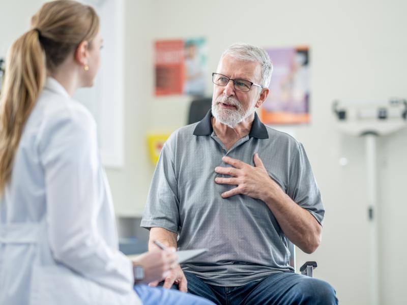 man consulting with doctor for chest pain 