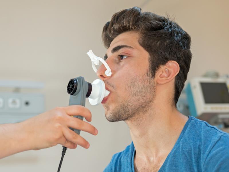 Patient taking spirometry test