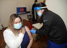 Cathy Vasquez receiving the COVID-19 vaccine