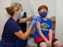 Inspira nurse administering the COVID vaccine to an adolescent boy