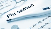 paper that reads "Flu Season" with thermometer on top