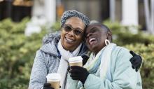 Elderly women laughing together