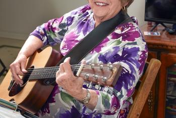 Portrait shot of a women with guitar