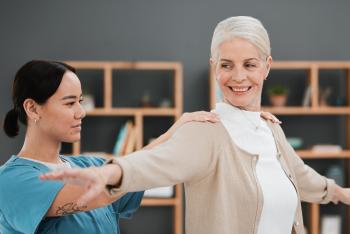 occupational therapist works with an elderly woman