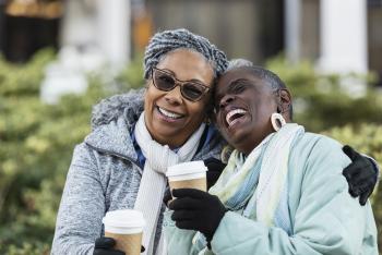 Elderly women laughing together